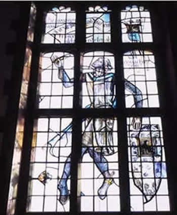 Glass window in Trinity College's Strachan Hall.