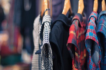Photo of clothes on a rack.