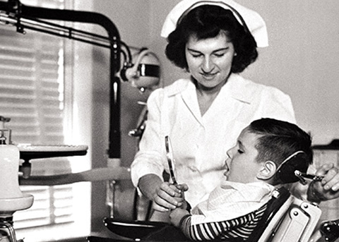 Photo of a nurse with a child in a dental practice