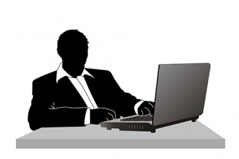 Illustration of a figure using a laptop computer.