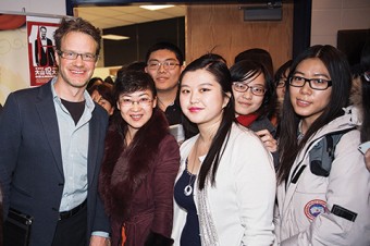 Photo of Mark Rowswell with students.