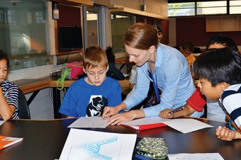 Instructor Janine Newton works with students at the Summer Math Kangaroo Camp