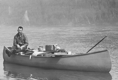 Photo of Harold Innis in a canoe.