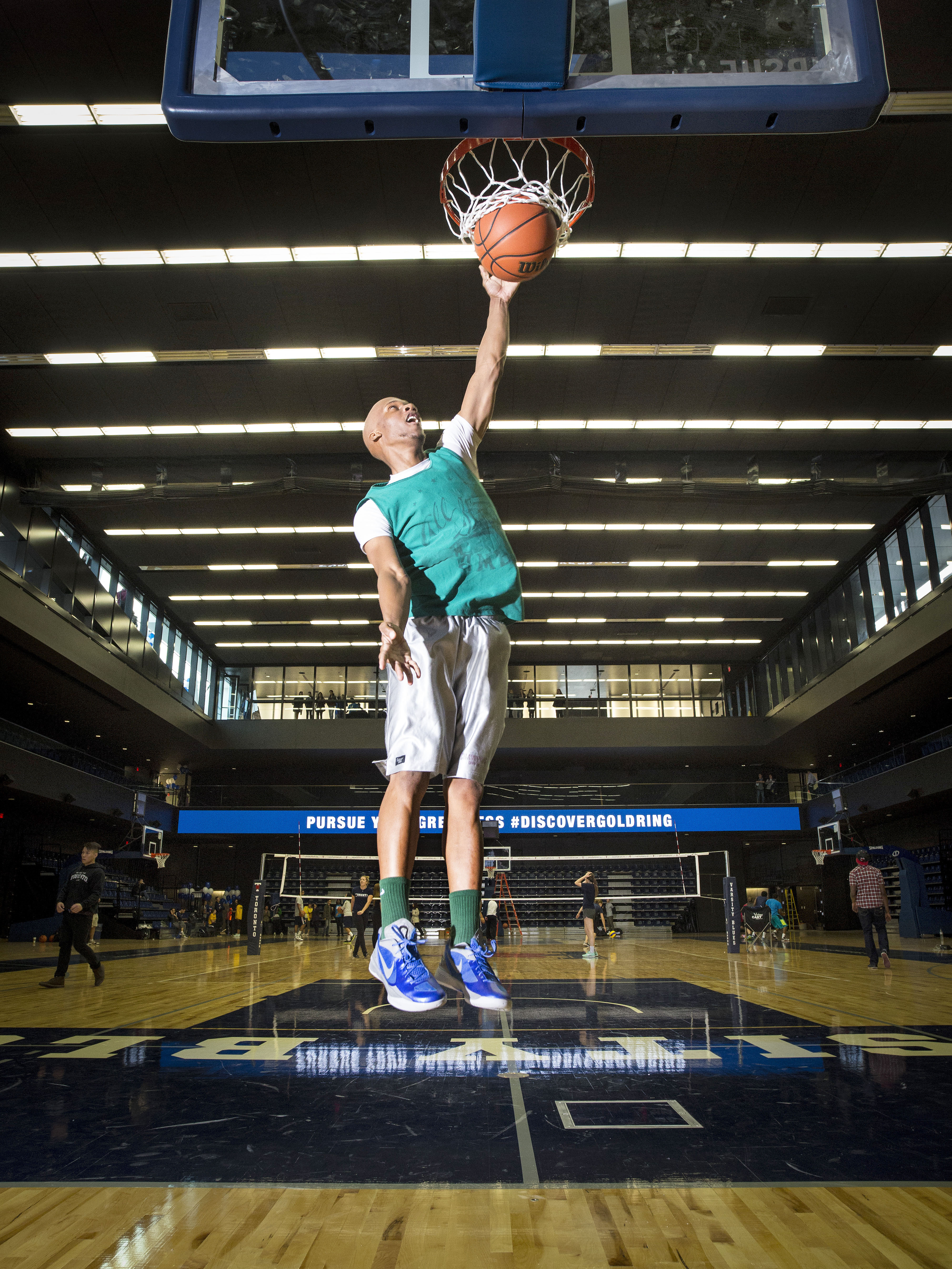 Fourth-year student McCair Tulloch goes up for a dunk at the new Goldring Centre for High Performance Sport. Photo by John Hryniuk