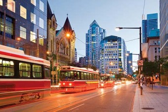 Photo of a Toronto street with a streetcar passing.