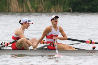 Rowers Kate Sauks and Liz Fenje on a rowboat.