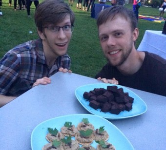 "Students Phillip Daniels and Peter Francis, co-founders of the club Bug Bites, serve up cricket-flour brownies and crackers with cricket hummus and roasted mealworms on front campus in September. Photo by Elspeth Mathau