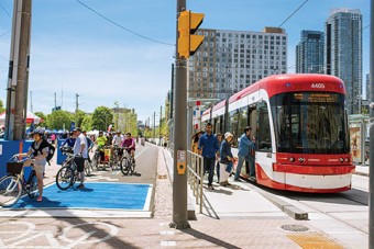 Photo of streetcar and bikers along Queen's Quay