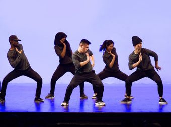 Photo of hip-hop dance group 9M5 performing onstage