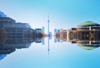 Photo of King's College Circle with the Medical Science Building, CN Tower and Convocation Hall on top and a mirror image on the bottom
