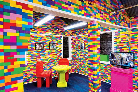 Photo of a room and furniture made of multicoloured lego