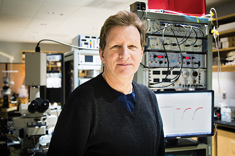 Photo of Graham Collingridge in a lab