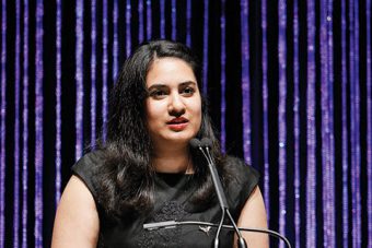 Photo of Ishita Aggarwal giving a speech.
