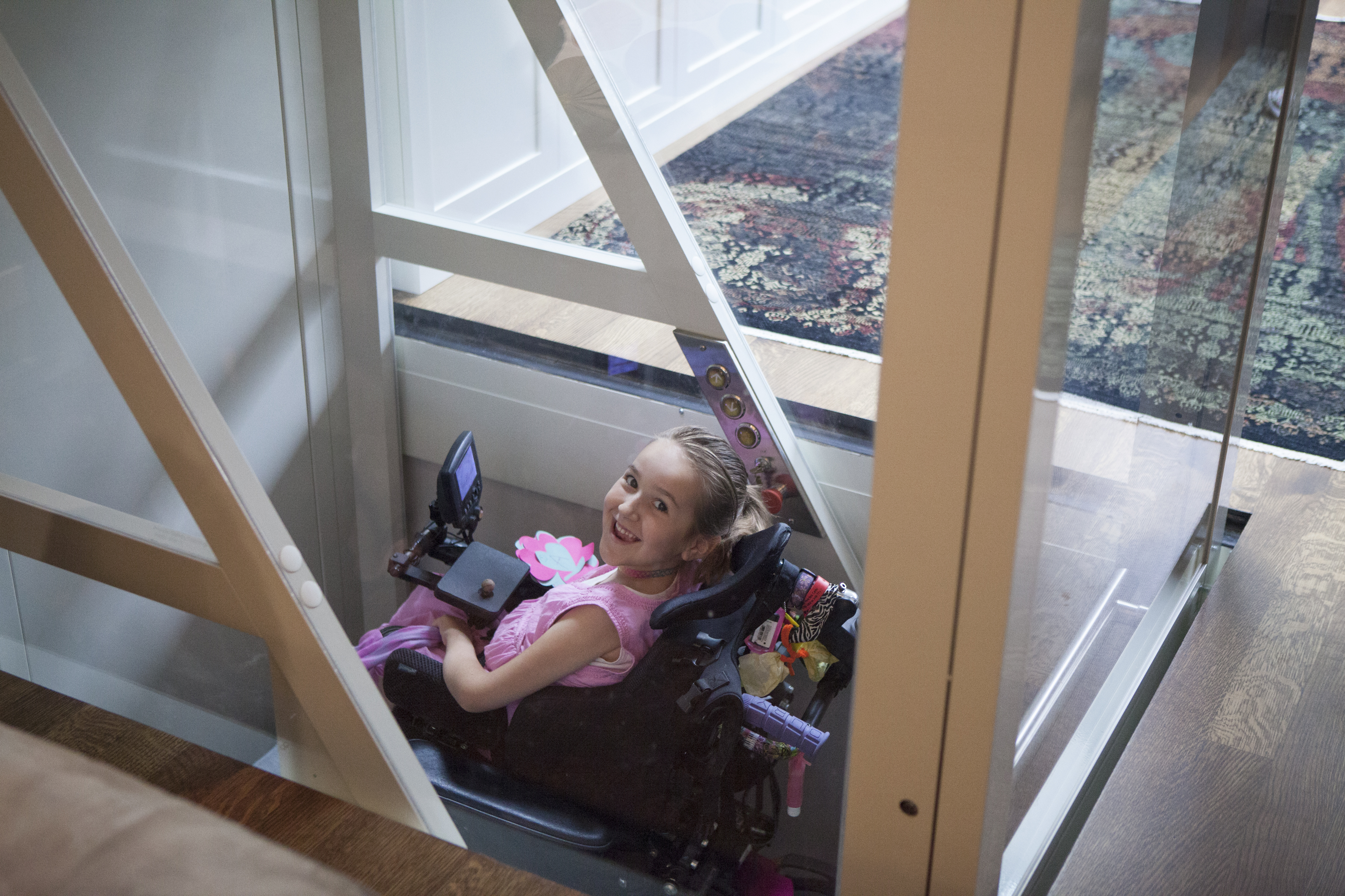 Asha Buliung, who is in a wheelchair, uses her home elevator