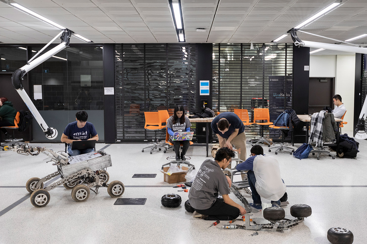 Engineering students building vehicles in the Engineering Society Arena