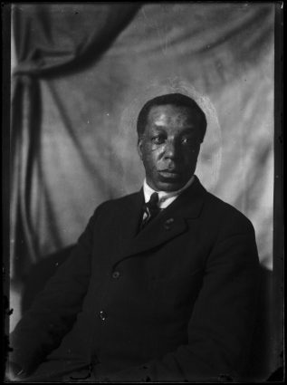 A black and white portrait of William (Billy) Beal, a Black settler who arrived in Swan Lake, Manitoba in 1906.