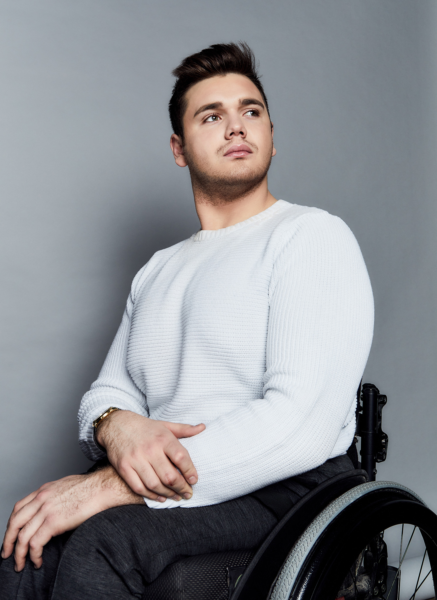 Headshot of George Alevizos with the upper part of his wheelchair visible
