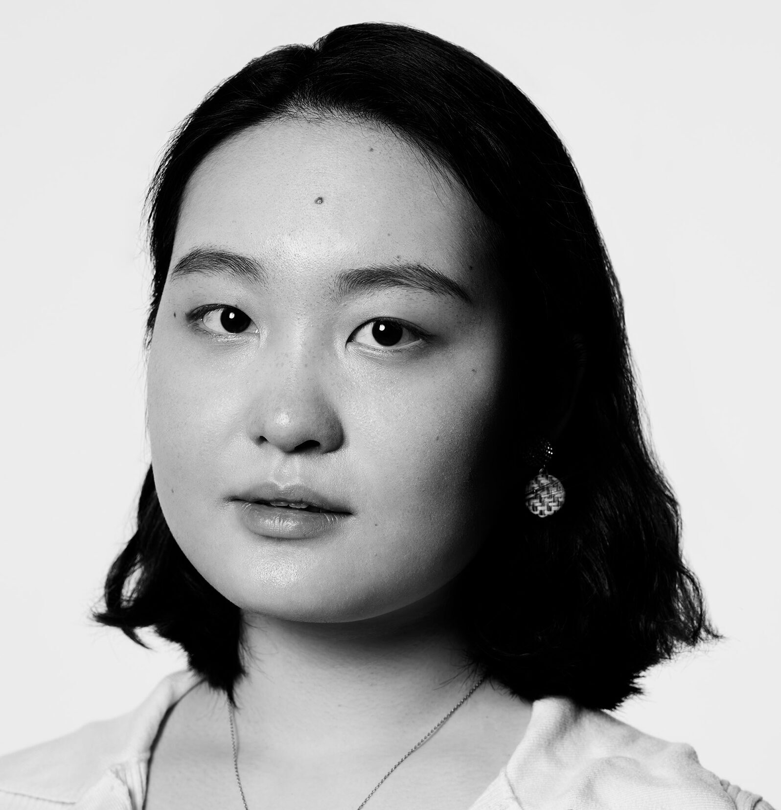 Black and white headshot of Chen Yang