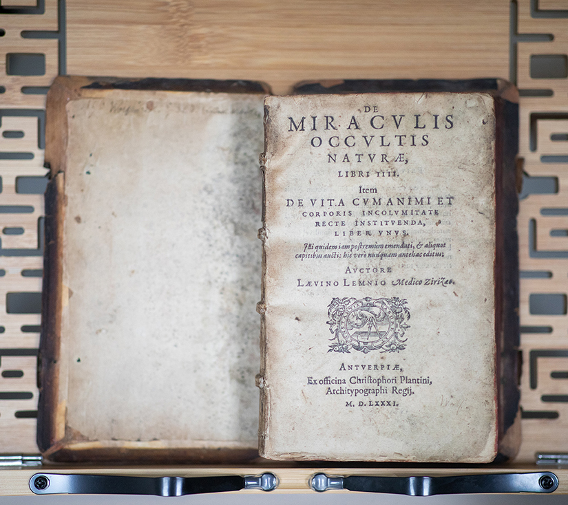 Overhead view of an early printed codex opened at the title page