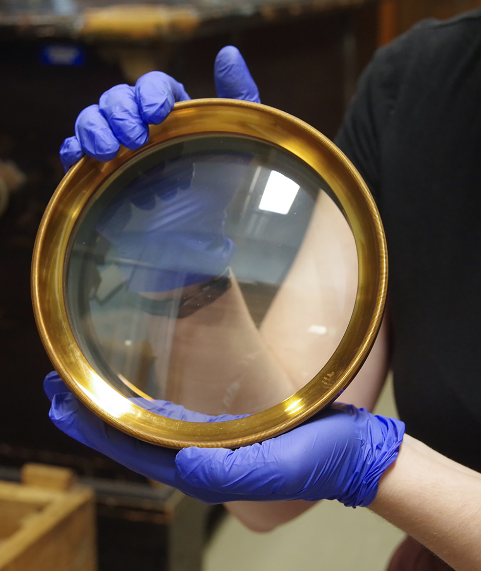 Close-up of a large brass-framed lens