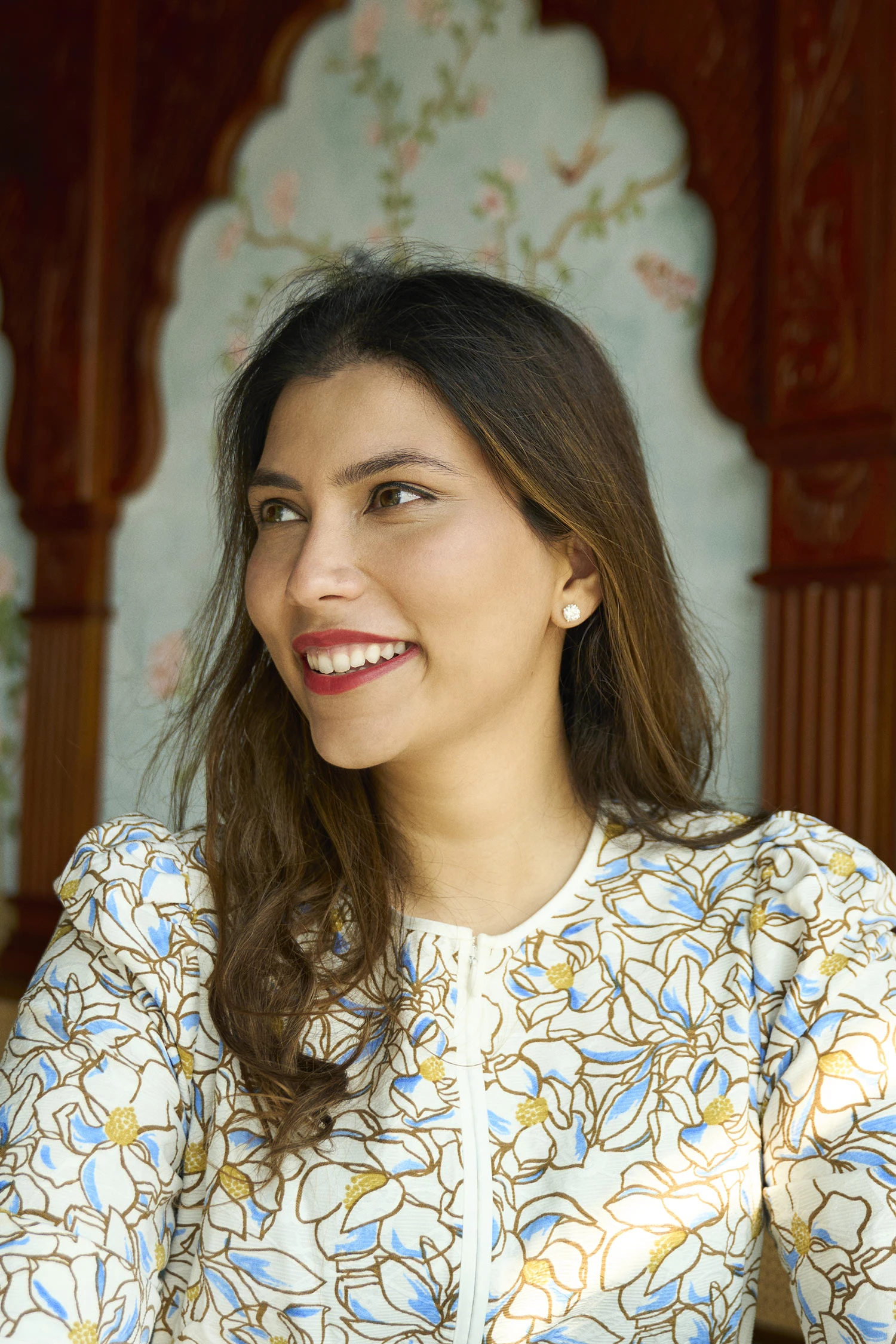 Close-up photo of Ambica Jain in a flower-patterned dress