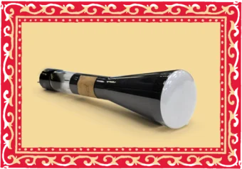 Close up photo of a tubular, mostly black-coloured glass object that widens into a cone-shape at one end. A white glassy surface covers the wide end.